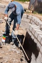 Builder insulating foundations Royalty Free Stock Photo