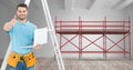 Builder with ladder and computer in font of 3D scaffolding Royalty Free Stock Photo