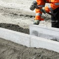 Builder laying bricks