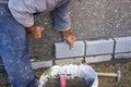 Builder laying bricks, constructing a wall