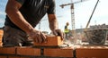 Builder laying bricks at construction site Royalty Free Stock Photo