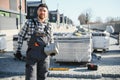 Builder laying a paving brick placing it on the sand foundation with gloved hands Royalty Free Stock Photo