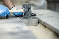 Builder laying a paving stone or brick Royalty Free Stock Photo