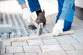 Builder laying paving tiles Royalty Free Stock Photo