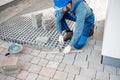 Builder laying paving tiles Royalty Free Stock Photo