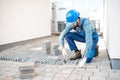 Builder laying paving tiles Royalty Free Stock Photo