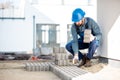Builder laying paving tiles Royalty Free Stock Photo