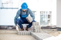 Builder laying paving tiles Royalty Free Stock Photo