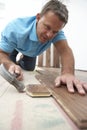 Builder Laying Wooden Flooring Royalty Free Stock Photo