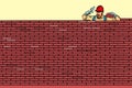 The Builder lays brick masonry at the top