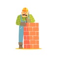 Builder Leveling Brick Wall On Construction Site