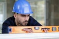 builder looks at construction level checks horizontal surface