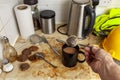 Builder making a cup of tea in his dirty kitchenette