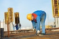 Builder making reinforcement for concrete Royalty Free Stock Photo