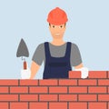 Builder man is building a brick wall