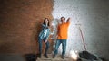 Builder man and the girl with the tool. Make repairs in the house. Dance and rejoice.