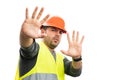 Builder man having scared expression making stay away gesture