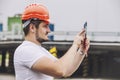 Builder man working with a tablet in a protective helmet Royalty Free Stock Photo