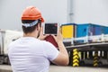 Builder man working with a tablet in a protective helmet Royalty Free Stock Photo