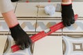 The builder-mason controls the level of the horizontal tile with