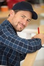 builder measuring window using tape measure and pencil Royalty Free Stock Photo