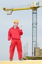 Builder operating the tower crane Royalty Free Stock Photo