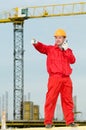 Builder operating the tower crane Royalty Free Stock Photo