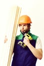 Builder in orange helmet and uniform. Finished work, building concept