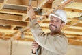 builder passing wires in wood structure Royalty Free Stock Photo
