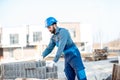 Builder with paving blocks outdoors Royalty Free Stock Photo