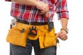 Builder placing wrench in pocket close-up