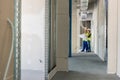 Builder with plan inspecting the construction site Royalty Free Stock Photo