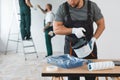 Builder preparing to paint the apartment