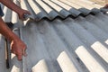 Builder repair dangerous asbestos old roof tiles Royalty Free Stock Photo