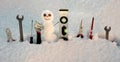 Builder repair tools. Little snowman with repairing instrument. Snow man worker. Royalty Free Stock Photo