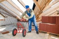 Builder roofer and wheel barrow