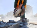 The builder saw circular saw concrete curb. Royalty Free Stock Photo