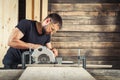 Builder saws a board Royalty Free Stock Photo