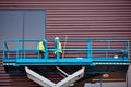 Builder on a Scissor Lift Platform at a construction site Royalty Free Stock Photo