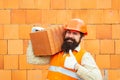 Builder shows thumb up. Labor protection at a construction site. Safety rules for builders. Happy builder in orange