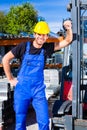 Builder with site pallet transporter or lift fork truck Royalty Free Stock Photo
