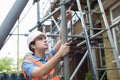 Builder On Site Putting Up Scaffolding Royalty Free Stock Photo