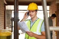 Builder On Site Using Mobile Phone Royalty Free Stock Photo