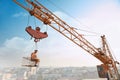 Builder sitting on construction on high and eating.