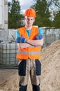 Builder standing with arms crossed