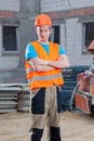 Builder standing at building area