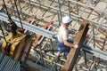 Builder with steel beam Royalty Free Stock Photo