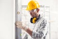 Builder or contractor using a large spirit level Royalty Free Stock Photo
