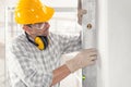 Builder or contractor using a large spirit level Royalty Free Stock Photo