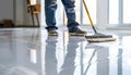 Builder sweeping the floor after renovation of house Royalty Free Stock Photo